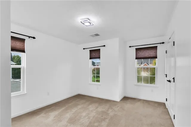 an empty room with windows