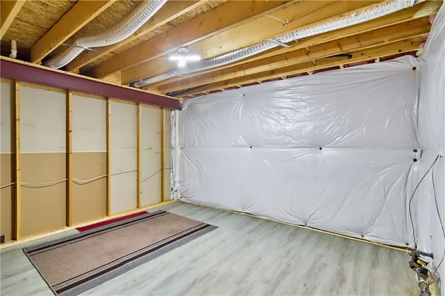 a view of a garage with wooden floor