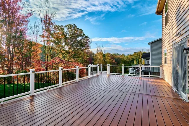 a view of a balcony with wooden floor