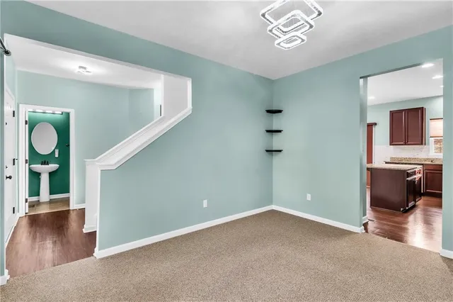 a view of livingroom with hardwood floor and a ceiling fan