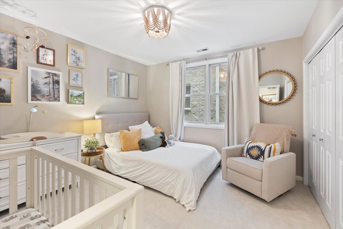 1132 West Wolfram Street, Unit 3 Chicago, IL 60657 - Photo 15 of 26 a bedroom with a bed and a window