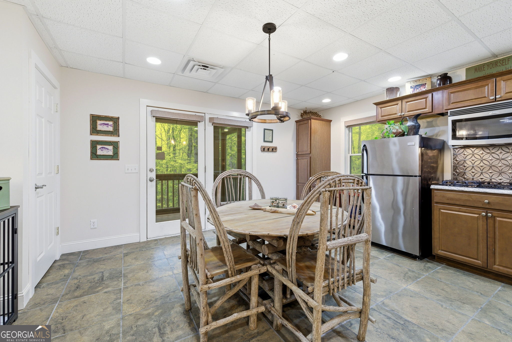 634 Little Hawk Road Sautee Nacoochee, GA 30571 - Photo 35 of 54 a view of a dining room with furniture window and wooden floor