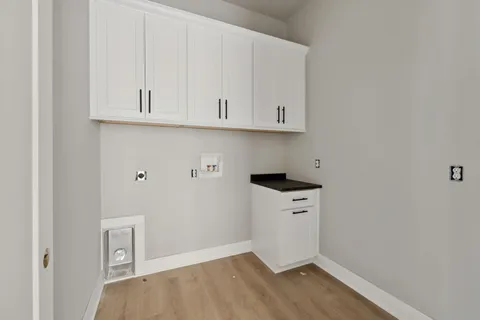 a view of cabinets and wooden floor