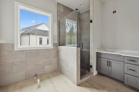 a bathroom with a bathtub and a shower