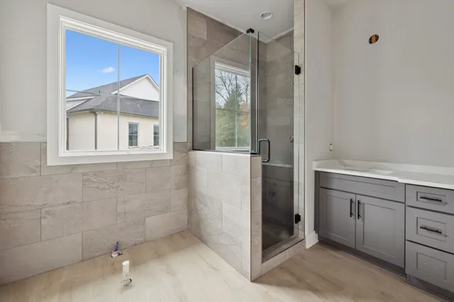 a bathroom with a bathtub and a shower