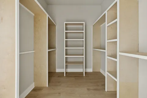 a view of an empty walk in closet