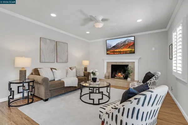 a living room with furniture and a fireplace