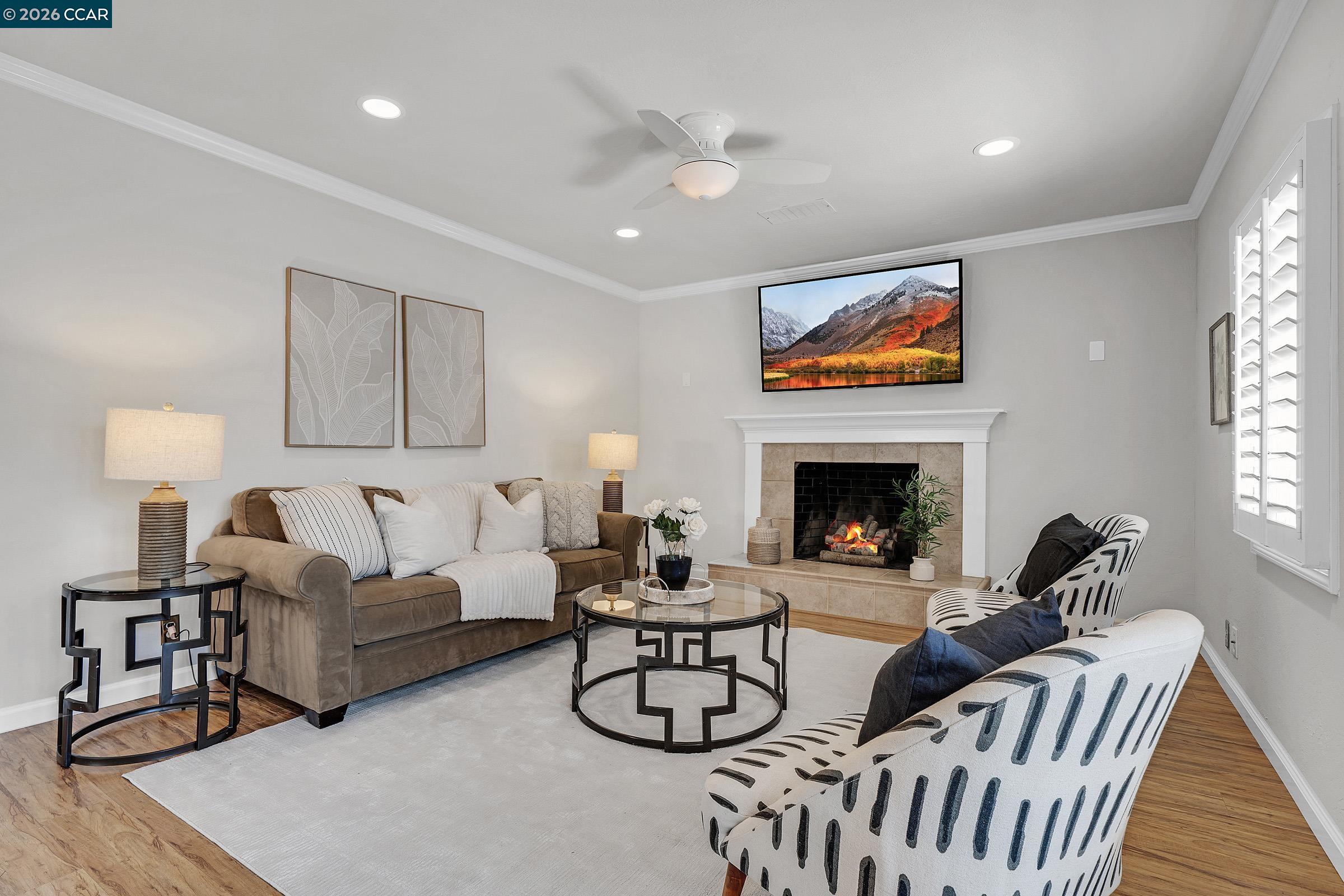 2415 Crestline Road Pleasanton, CA 94566 - Photo 13 of 40 a living room with furniture and a fireplace