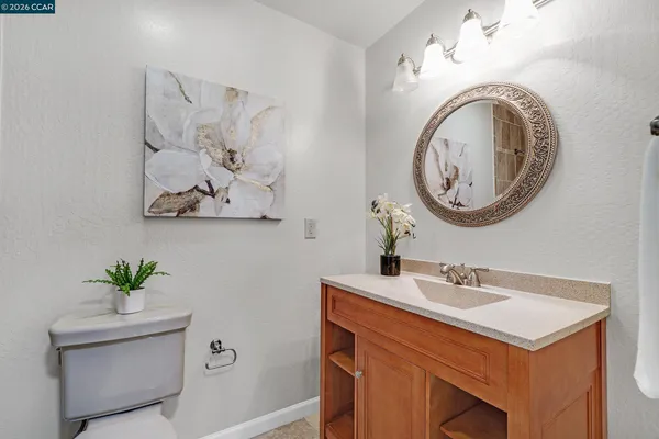 a bathroom with a toilet and a sink