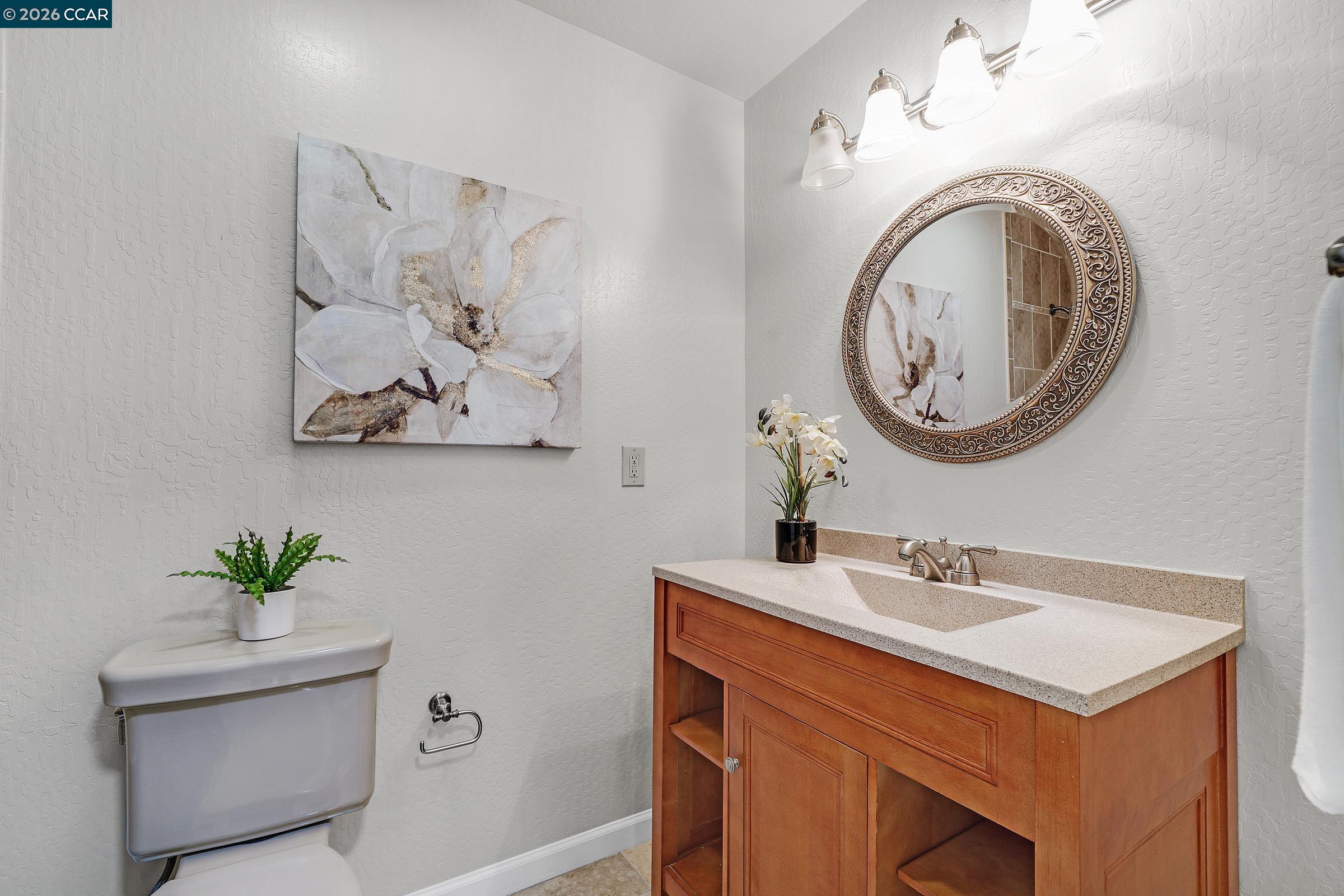 2415 Crestline Road Pleasanton, CA 94566 - Photo 21 of 40 a bathroom with a toilet and a sink