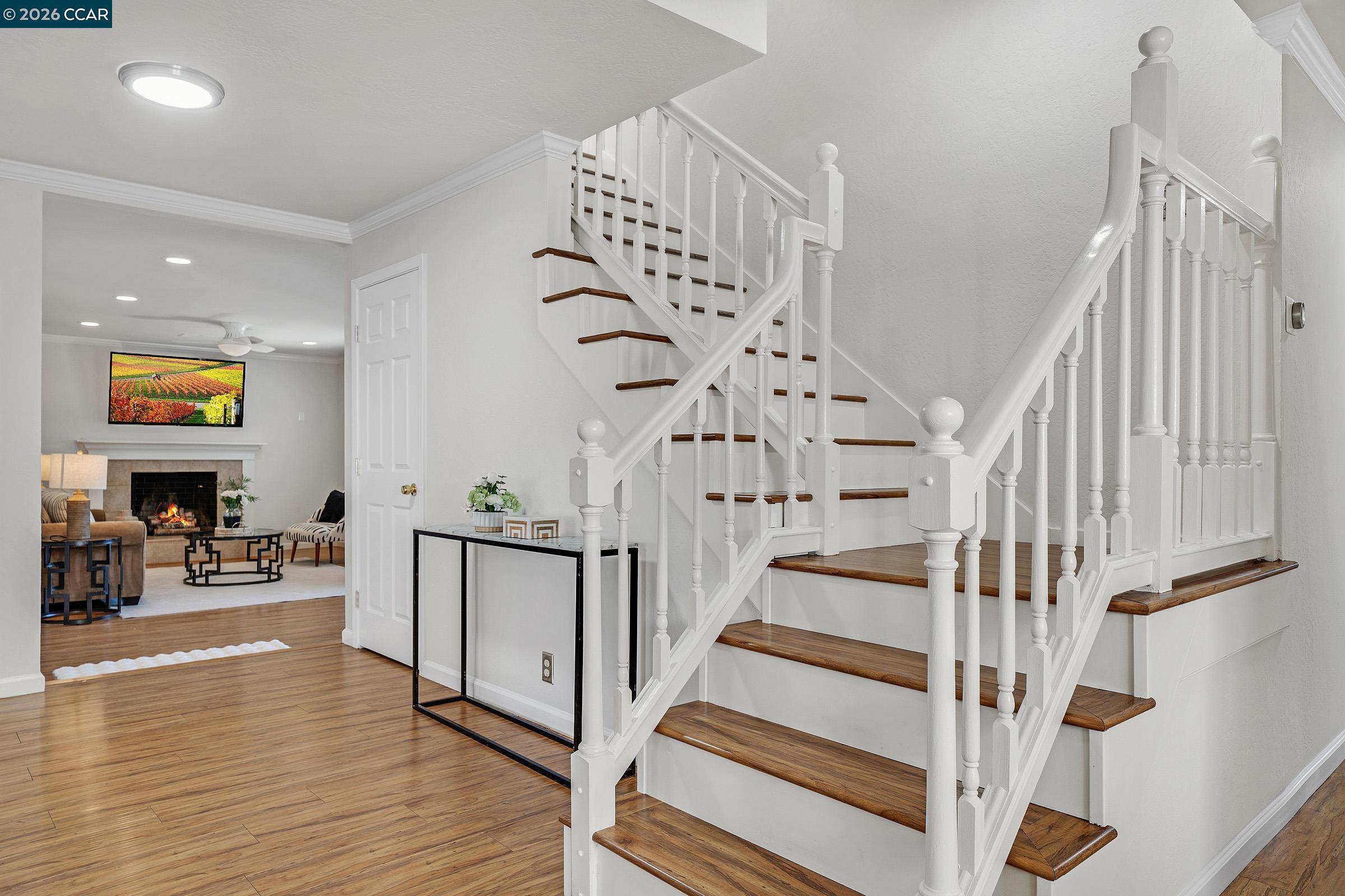 2415 Crestline Road Pleasanton, CA 94566 - Photo 24 of 40 a view of entryway with wooden floor and stairs