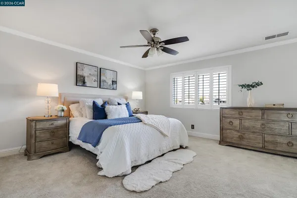 a bedroom with bed and window