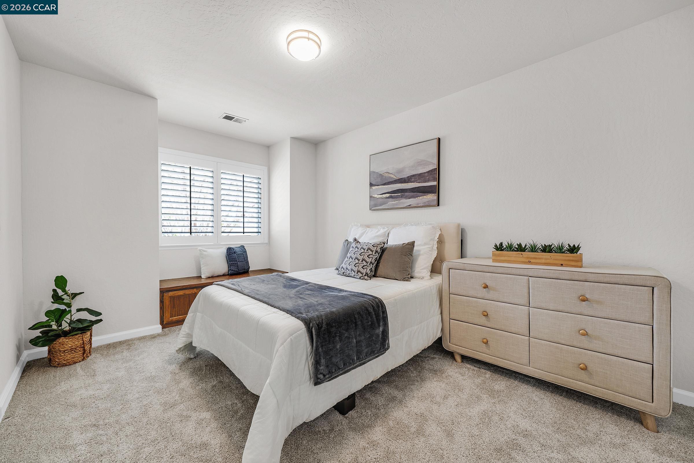 2415 Crestline Road Pleasanton, CA 94566 - Photo 29 of 40 a bed room with a bed and a potted plant