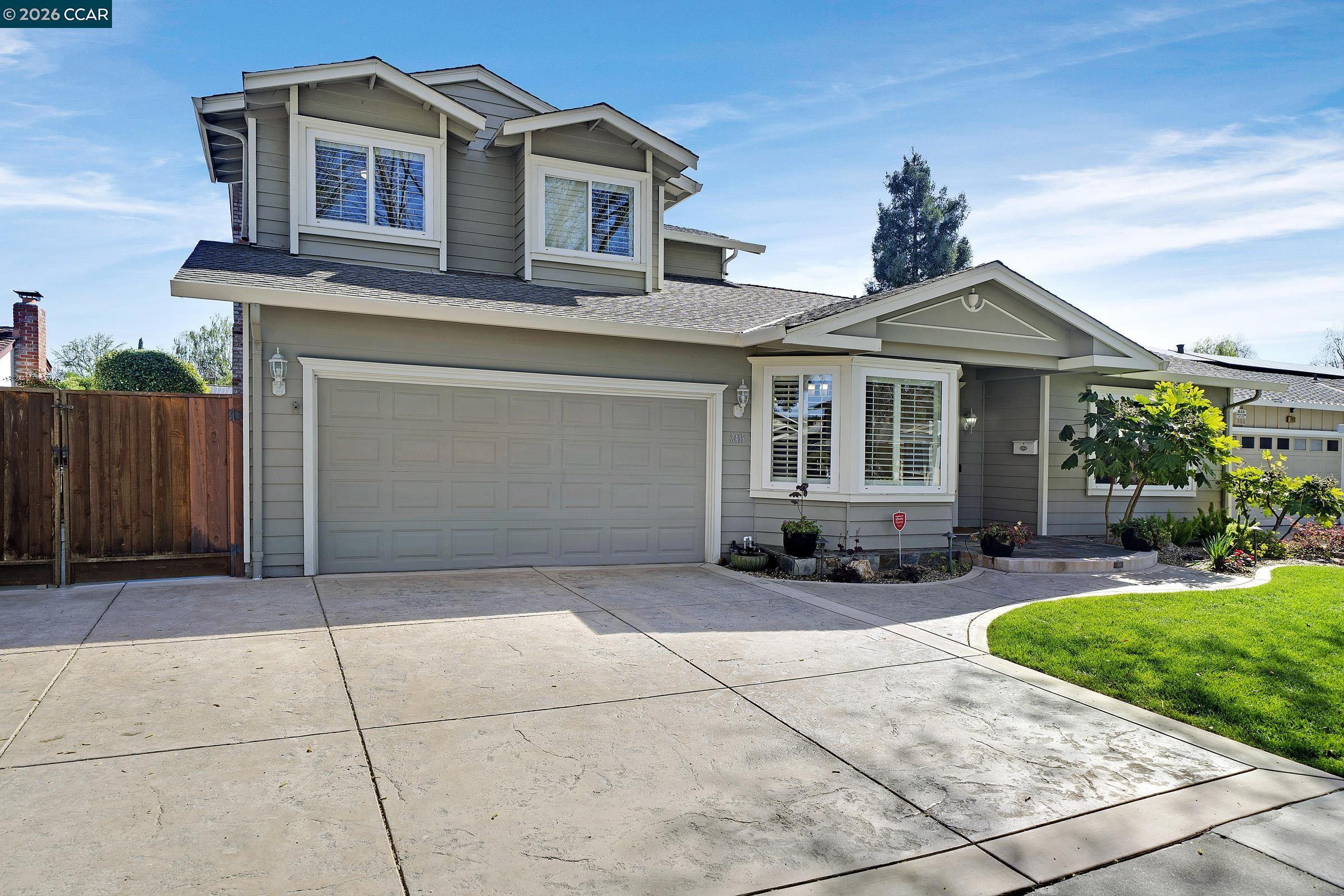 2415 Crestline Road Pleasanton, CA 94566 - Photo 40 of 40 a front view of a house with a garden and plants