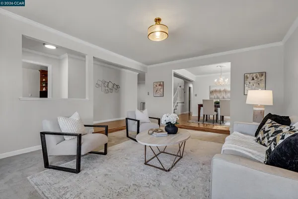 a living room with furniture and a lamp