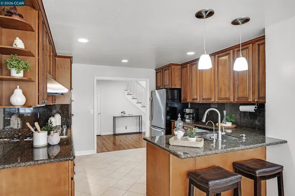 a kitchen with a sink cabinets and window