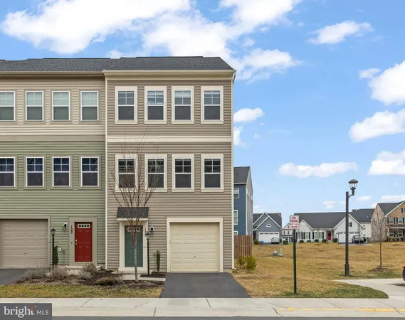 a front view of a building with a garden