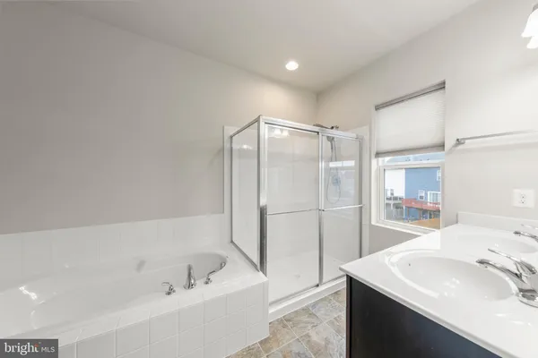 a bathroom with a sink and a bathtub