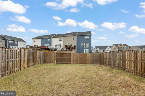 a view of a backyard with a fence