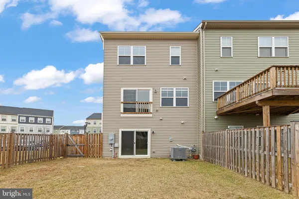 a front view of a house with a fence