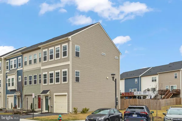 a front view of a building with parking space