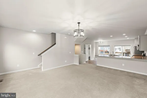 a view of a livingroom with a furniture and chandelier