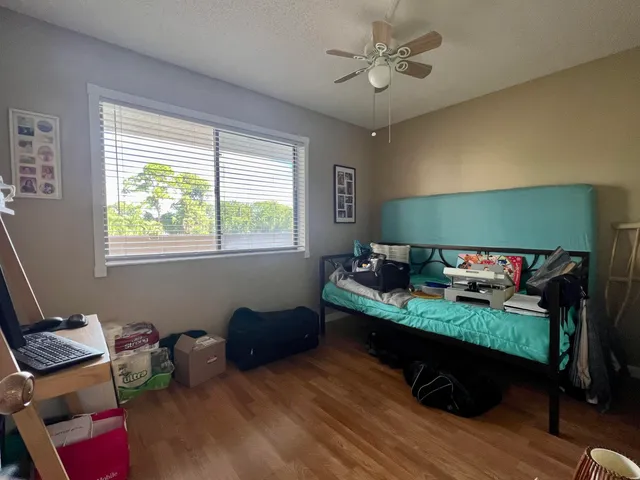 a bed room with furniture and a window