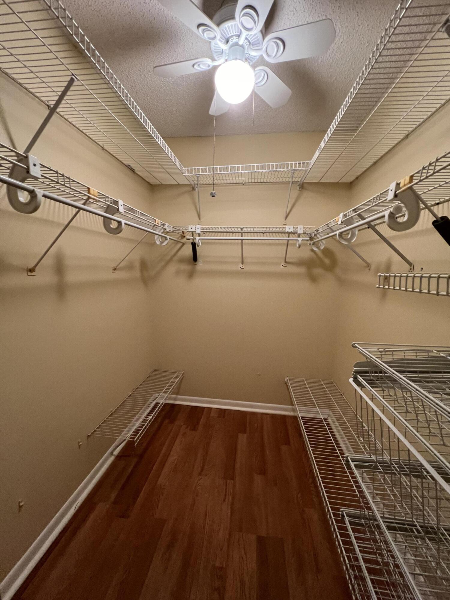 3154 Via Poinciana, Unit 214 Lake Worth, FL 33467 - Photo 16 of 23 a view of a room with racks on the wall