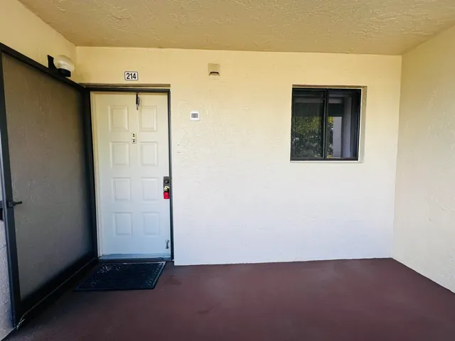 a view of a hallway with staircase