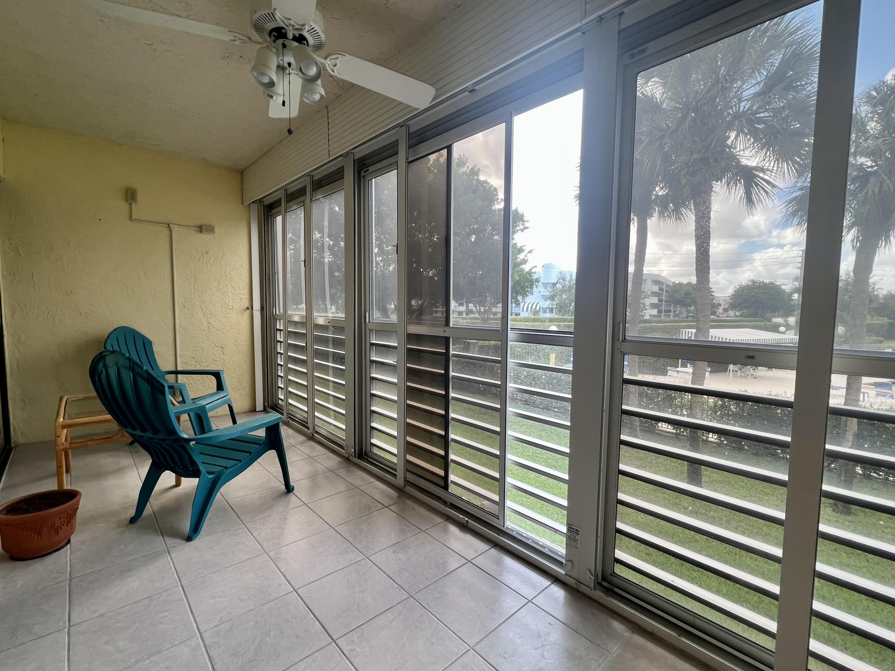 3154 Via Poinciana, Unit 214 Lake Worth, FL 33467 - Photo 19 of 23 a view of a room with furniture and a window