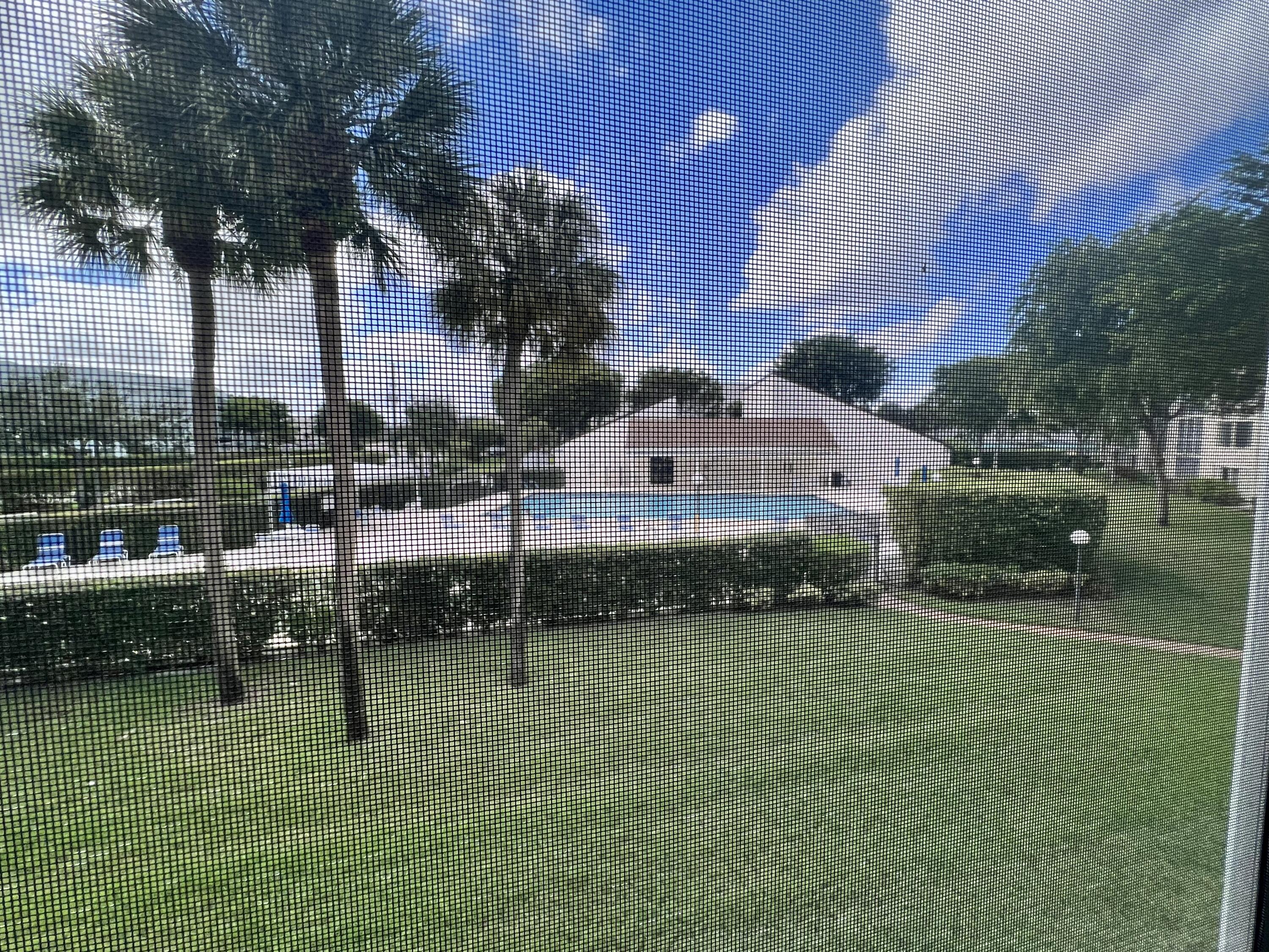 3154 Via Poinciana, Unit 214 Lake Worth, FL 33467 - Photo 20 of 23 a view of a garden