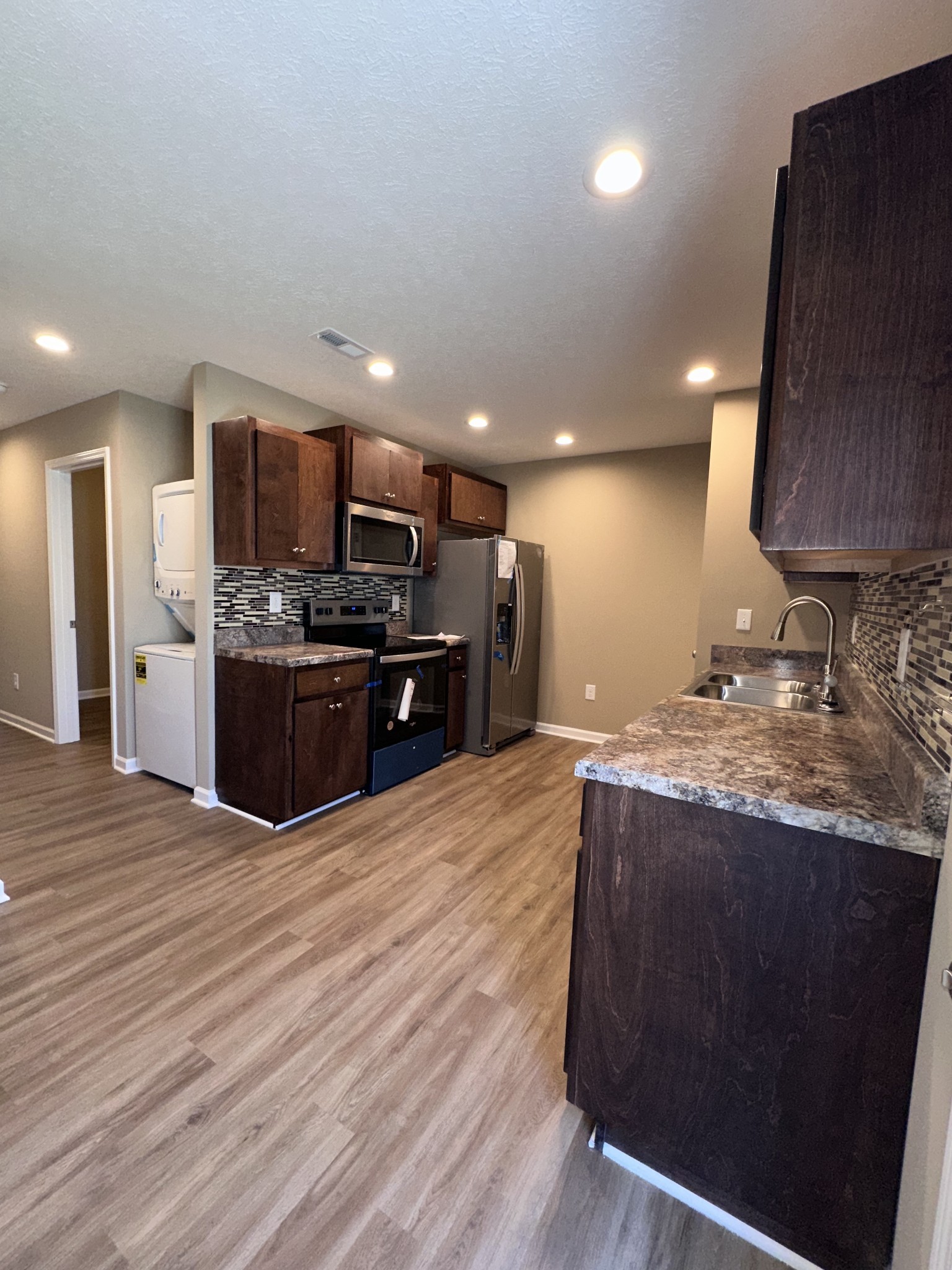 517 Weaver Street, Unit 4 Tullahoma, TN 37388 - Photo 1 of 22 a kitchen with stainless steel appliances granite countertop a stove a sink and a refrigerator