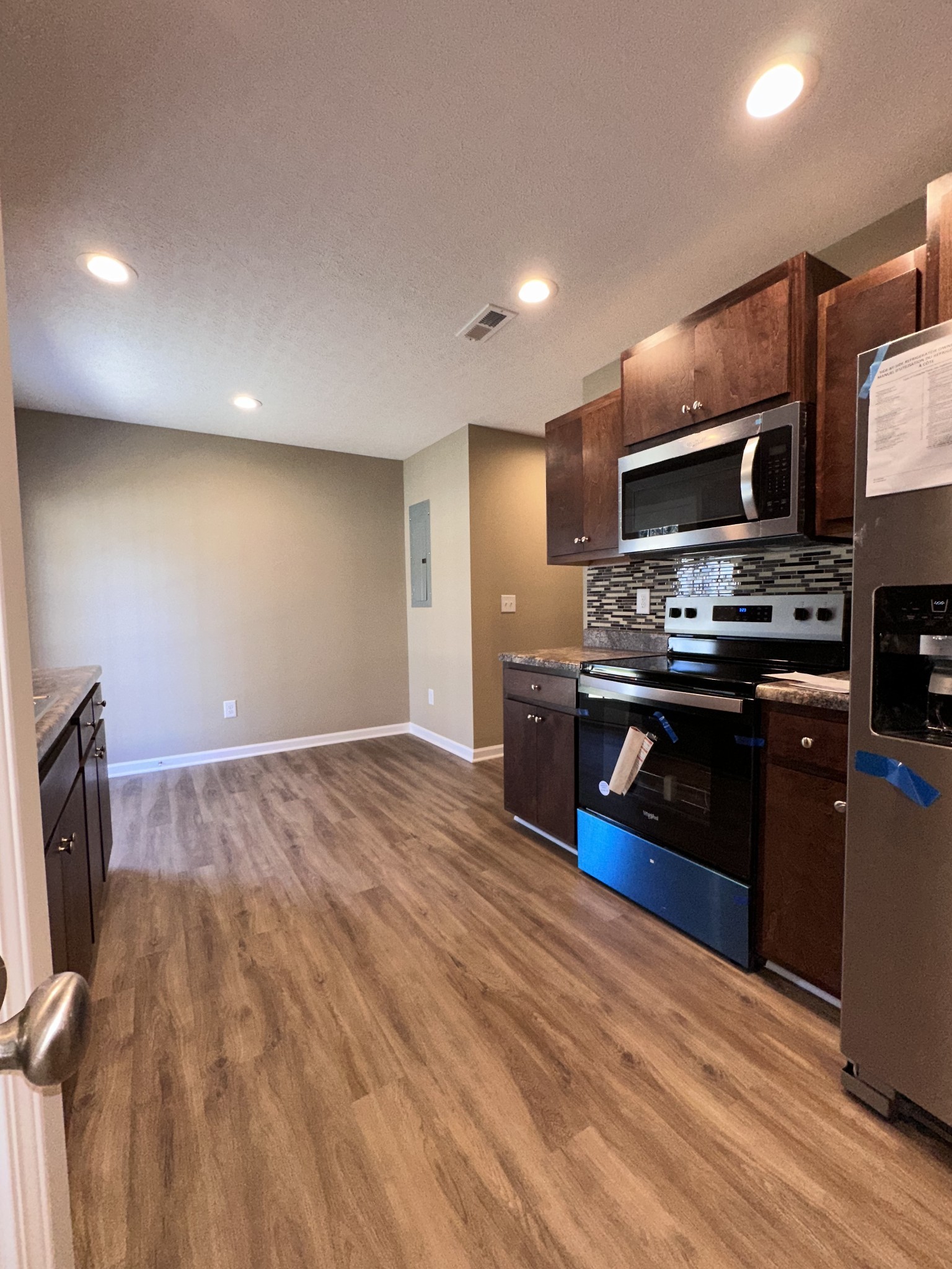 517 Weaver Street, Unit 4 Tullahoma, TN 37388 - Photo 11 of 22 a kitchen with stainless steel appliances granite countertop a stove a sink and a refrigerator