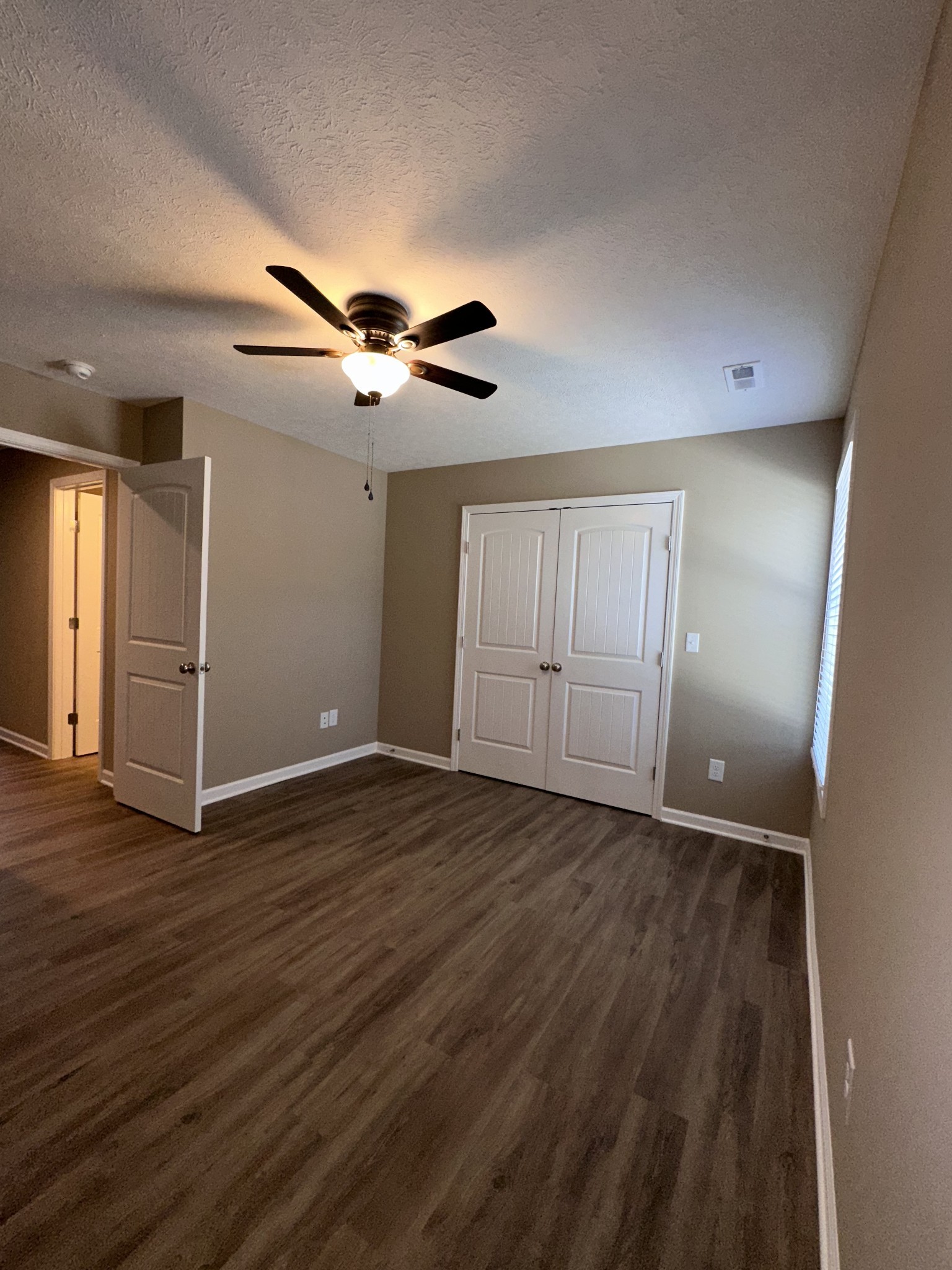 517 Weaver Street, Unit 4 Tullahoma, TN 37388 - Photo 14 of 22 wooden floor in an empty room with a window