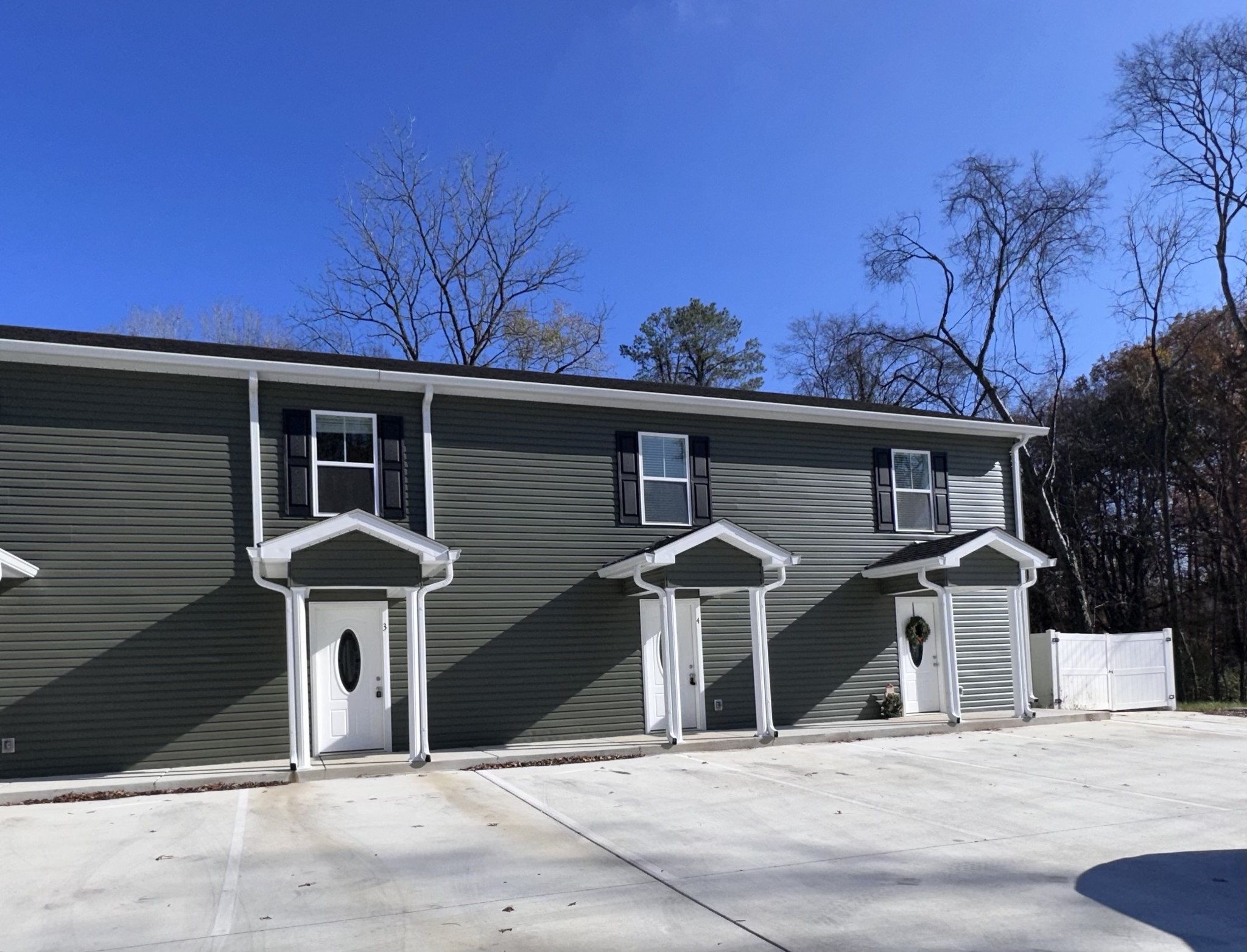517 Weaver Street, Unit 4 Tullahoma, TN 37388 - Photo 22 of 22 a view of a house with a yard and garage