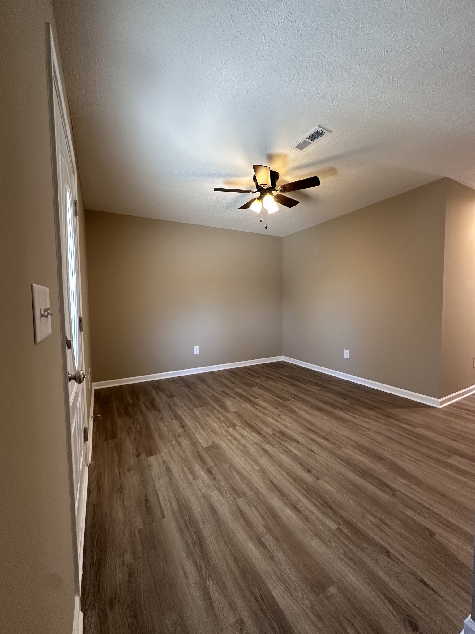 517 Weaver Street, Unit 4 Tullahoma, TN 37388 - Photo 3 of 22 wooden floor in an empty room