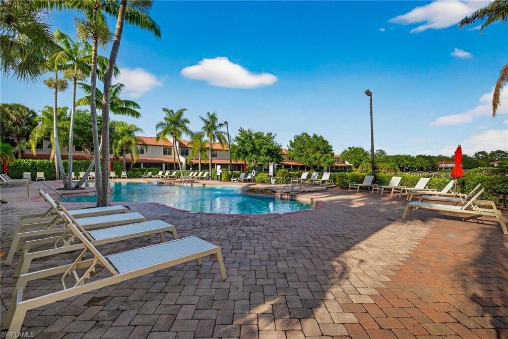 7845 Bristol Circle Naples, FL 34120 - Photo 26 of 31 a view of a swimming pool with a patio