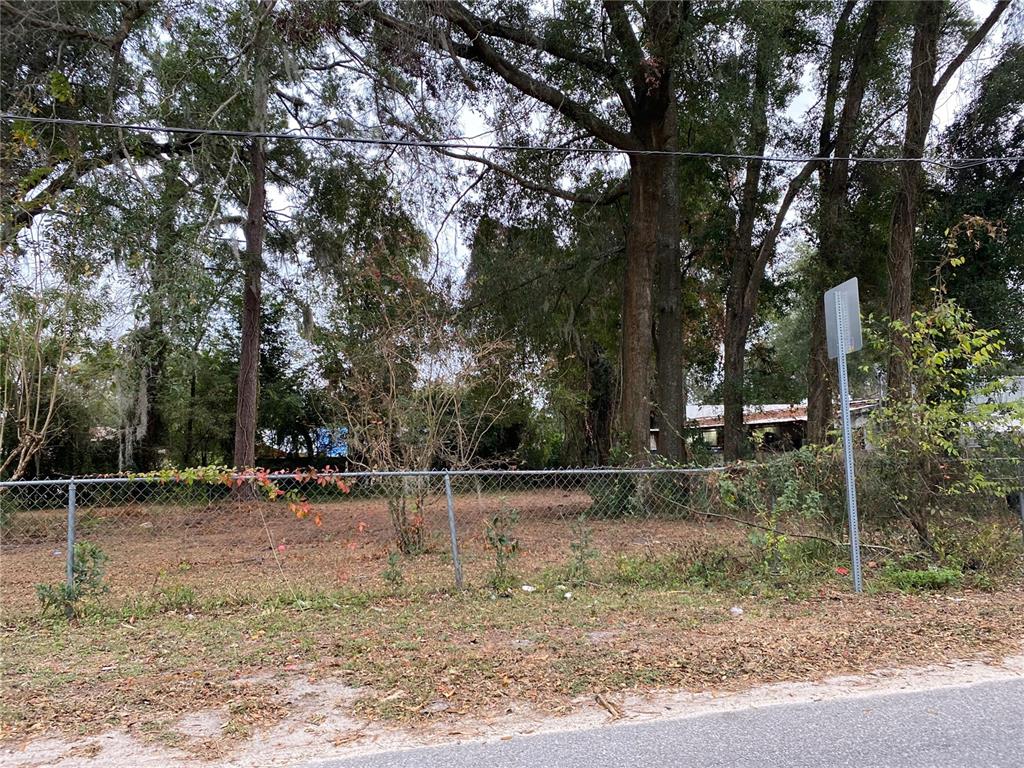 15th Avenue Ocala, FL 34475 - Photo 2 of 3 a backyard of a house with lots of trees