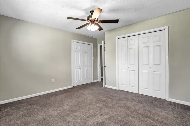 a view of a livingroom with a ceiling fan