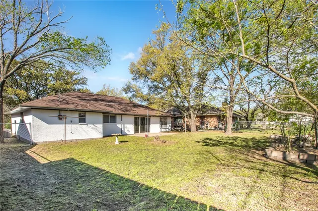 a view of a house with a yard patio and deck