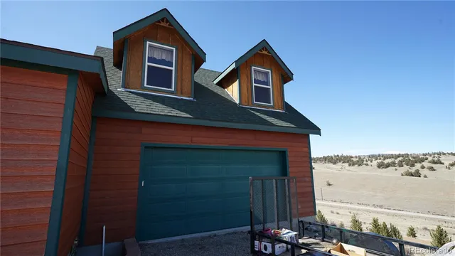a front view of a house with parking space