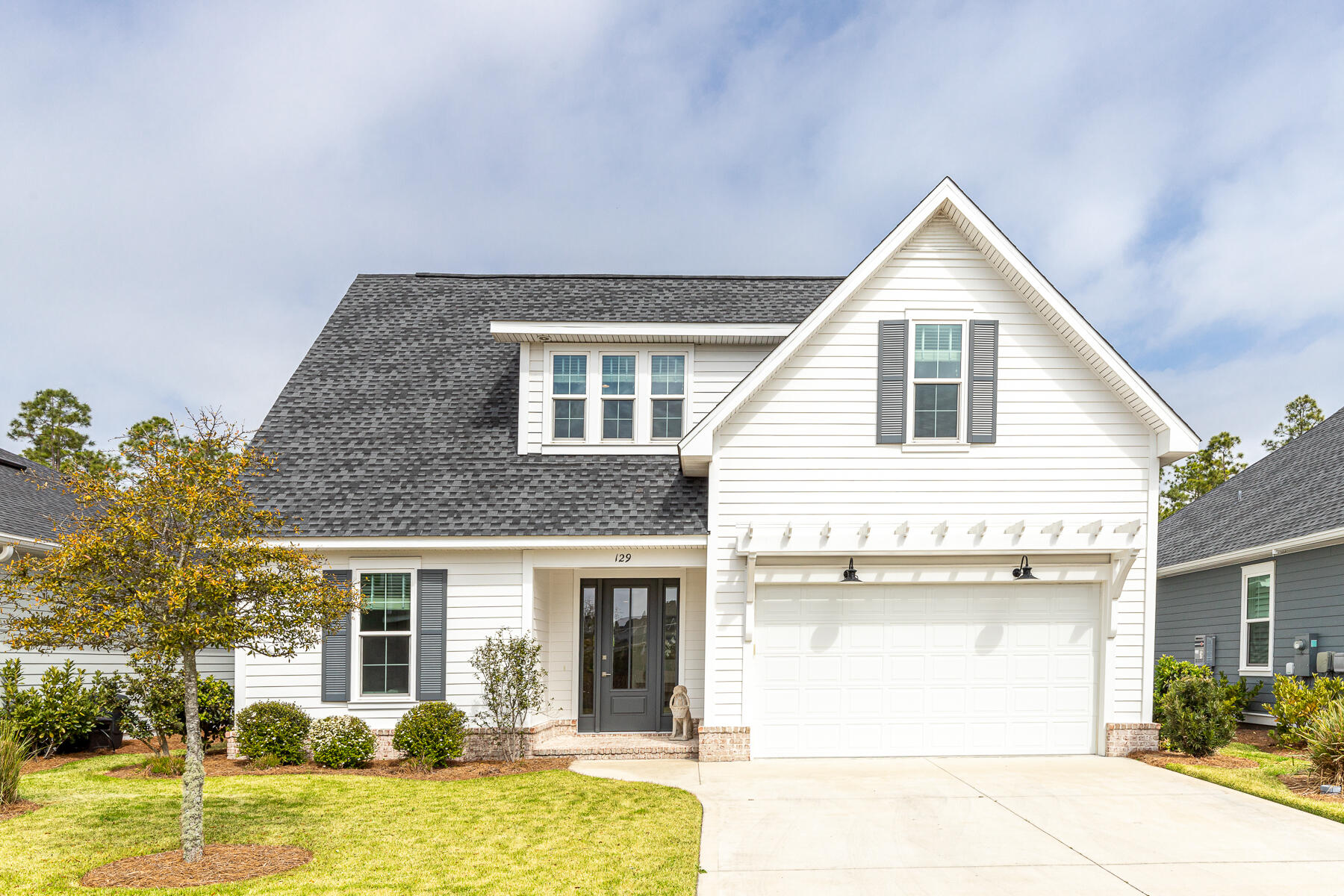a front view of a house with a yard