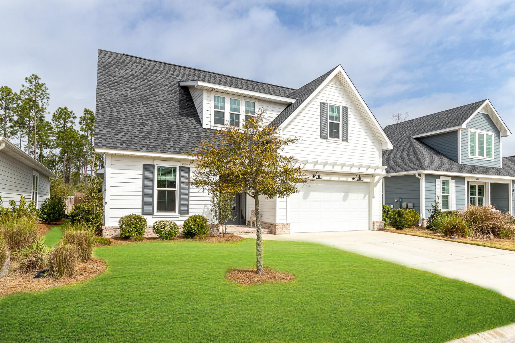129 Windrow Way Inlet Beach Inlet Beach, FL 32461 - Photo 19 of 26 a house that has a big yard and large trees