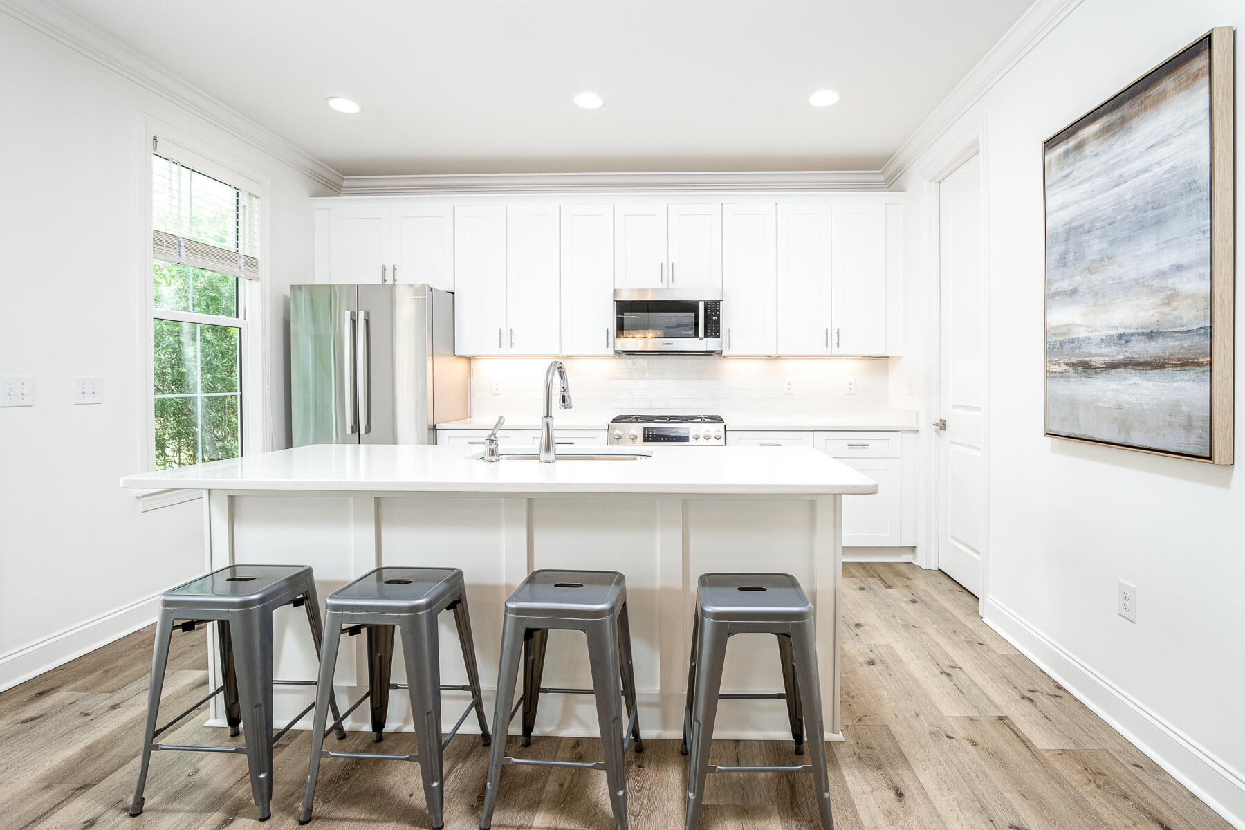 129 Windrow Way Inlet Beach Inlet Beach, FL 32461 - Photo 6 of 26 a kitchen with a dining table chairs and refrigerator