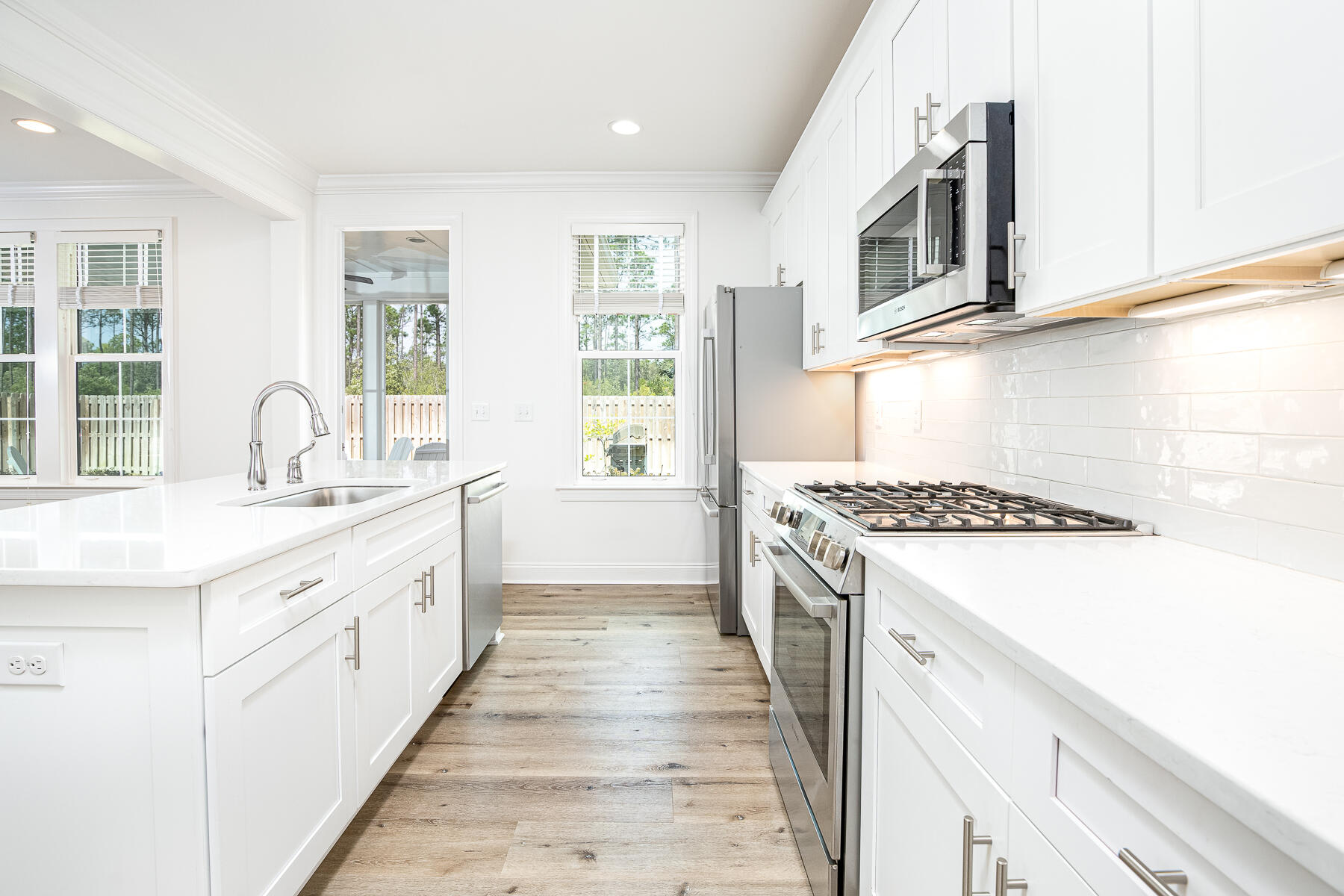 129 Windrow Way Inlet Beach Inlet Beach, FL 32461 - Photo 7 of 26 a kitchen with stainless steel appliances granite countertop a stove and a sink