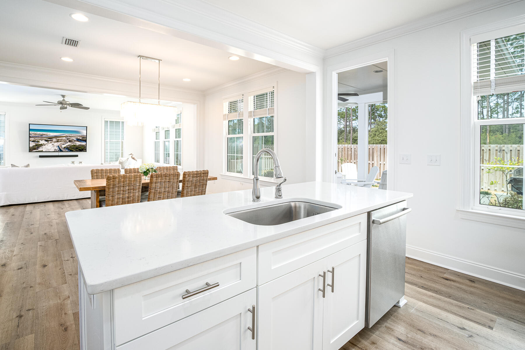 129 Windrow Way Inlet Beach Inlet Beach, FL 32461 - Photo 8 of 26 a view of a kitchen counter space with sink wooden floor and windows