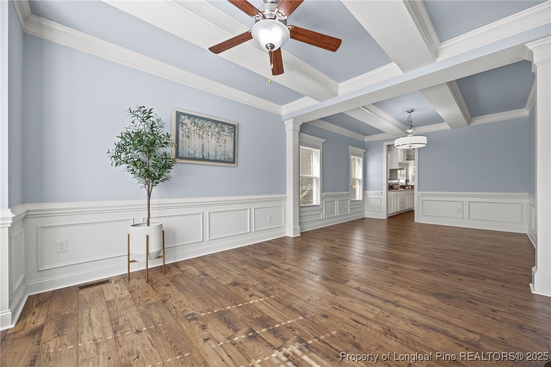 2904 Hampton Ridge Road Fayetteville, NC 28311 - Photo 11 of 50 a view of a room with wooden floor and a ceiling fan