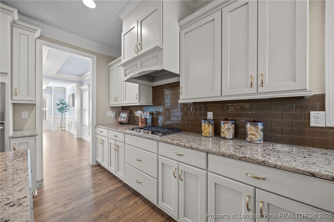 2904 Hampton Ridge Road Fayetteville, NC 28311 - Photo 16 of 50 a kitchen with granite countertop a sink and white cabinets