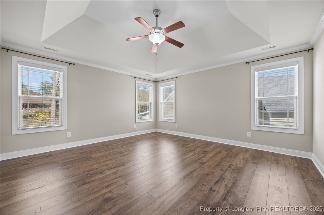 2904 Hampton Ridge Road Fayetteville, NC 28311 - Photo 28 of 50 a view of an empty room with wooden floor and a window