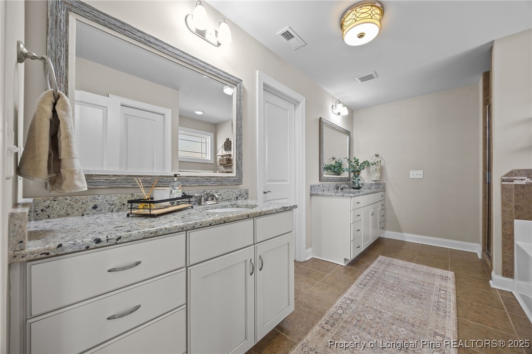 2904 Hampton Ridge Road Fayetteville, NC 28311 - Photo 30 of 50 a bathroom with a sink and a mirror